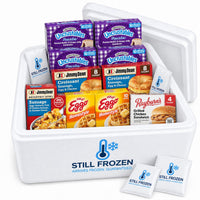 The Freezer Stock-Up in a Still Frozen foam cooler with gel packs: Uncrustables, Jimmy Dean croissants, Eggo waffles, Rayburn's chicken sandwiches, a Jimmy Dean breakfast bowl