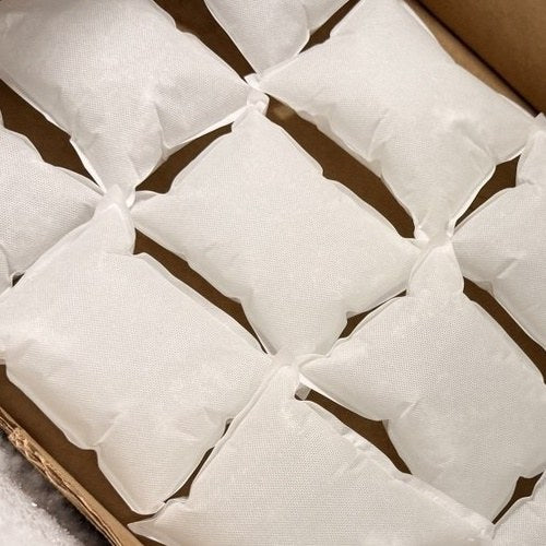 Close-up of our soft non-woven gel ice packs frozen flat in the warehouse freezer