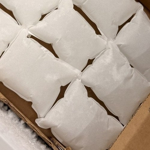 Rows of our soft non-woven gel ice packs freezing flat in the warehouse chest freezer